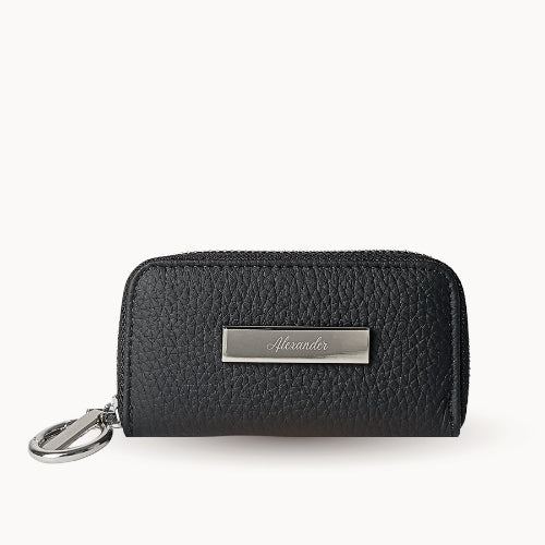 Black wallet with a silver tag on a white background